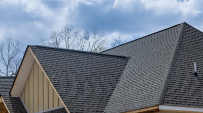 A residential roof and a clouds