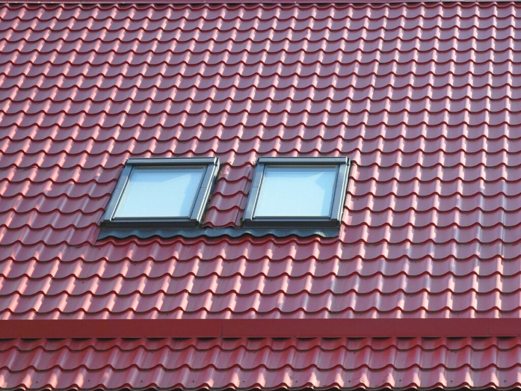 Red tiled roof with two skylights.