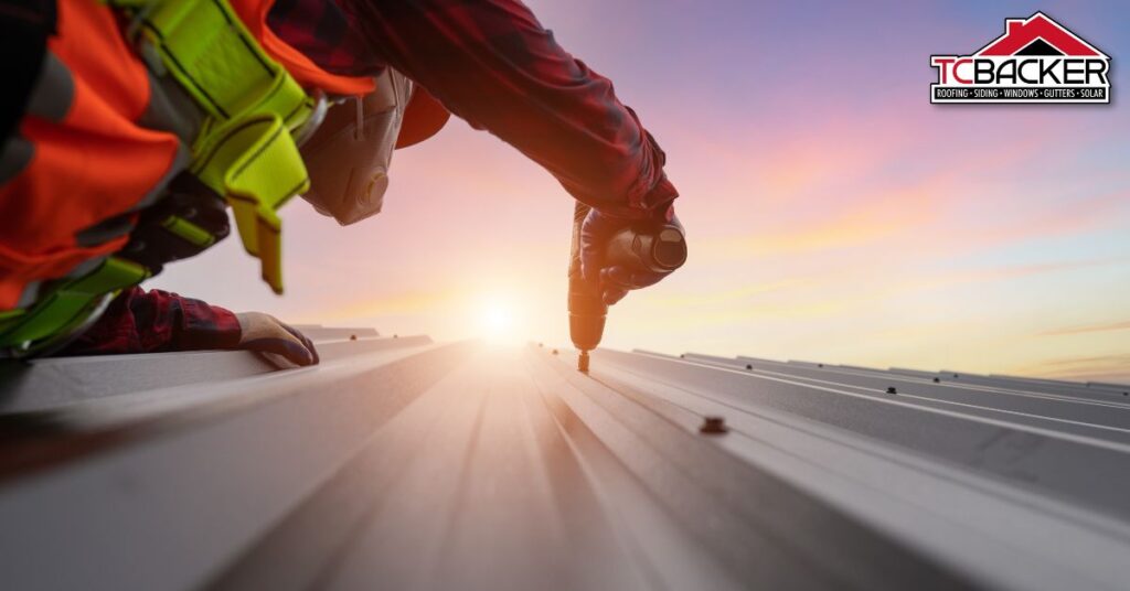 A worker with complete PPE drilling the roof.