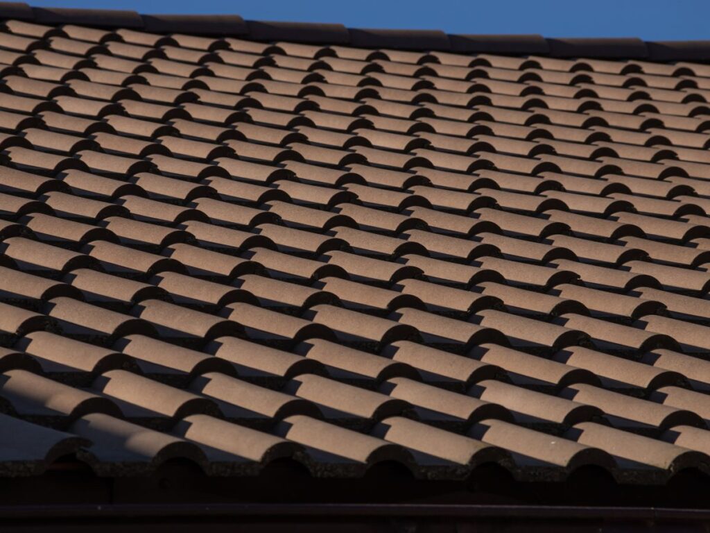 A close up of a brown tiled roof.