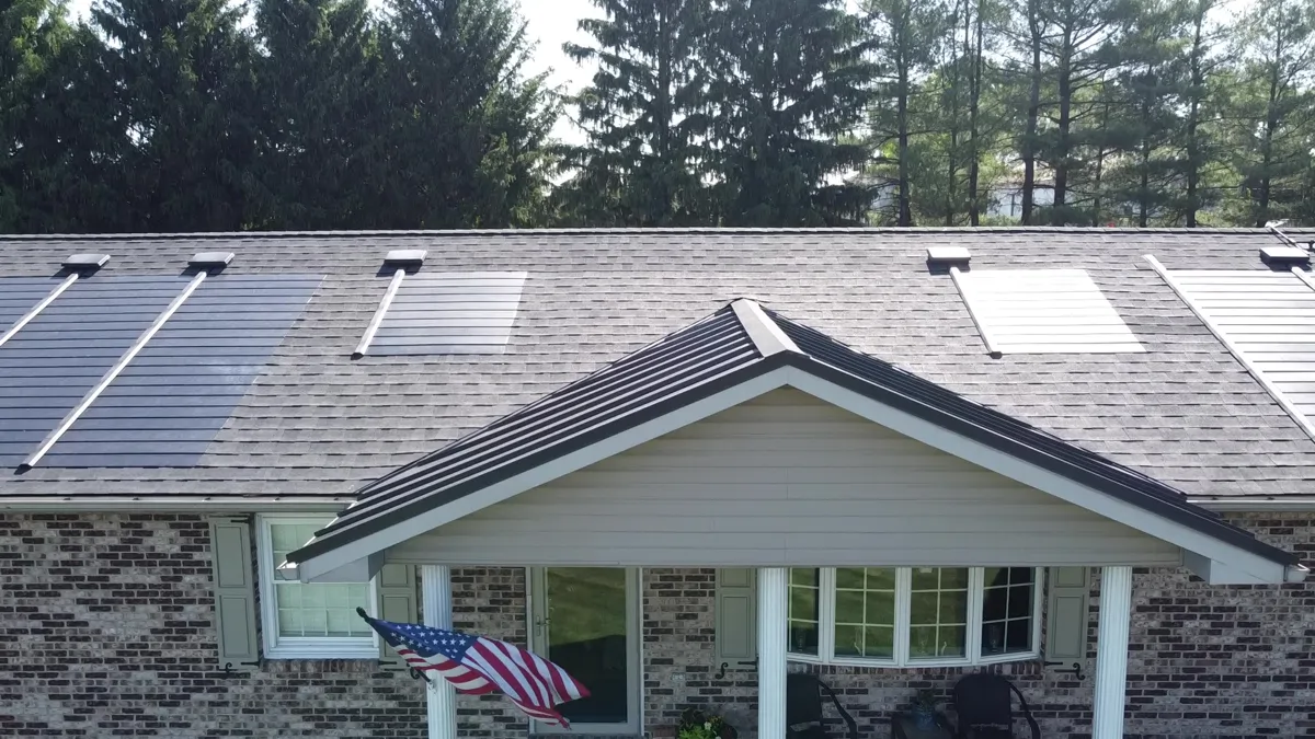 GAF Timberline Solar shingles integrated into an asphalt shingle roof on a brick home in Pennsylvania