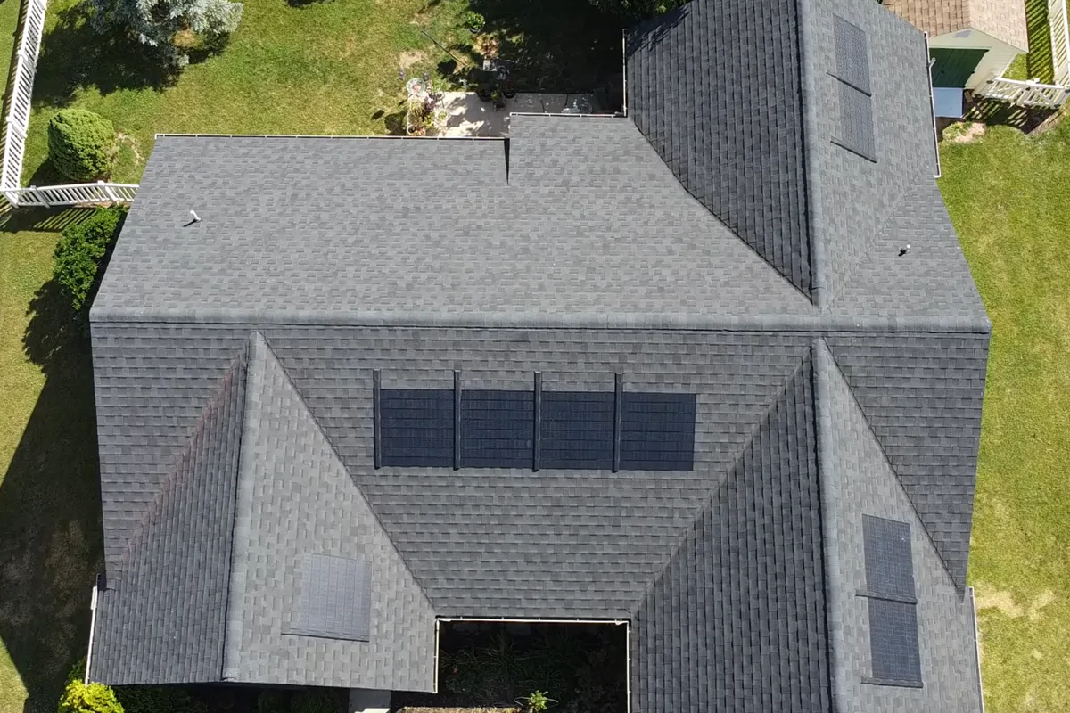 Aerial view of a GAF Timberline Solar shingle roof system installed on a home in Dover, PA